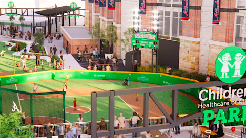 A mini ballpark for kids shown beside a large MLB stadium with brick walls outside Atlanta. 