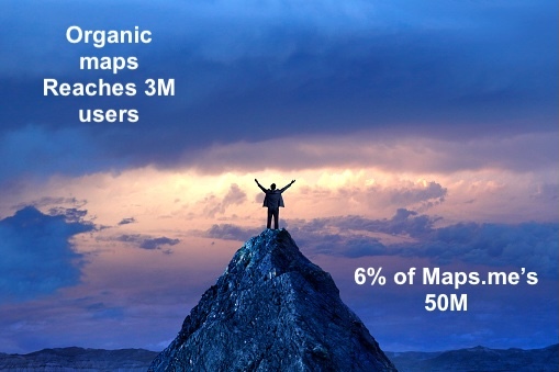 Guy on a small mountain top overlooking dark clouds with sunshine breaking through the middle. With the captions "Organic maps Reaches 3M" in the top left and in the bottom right "6% of Maps.me's 50M" 