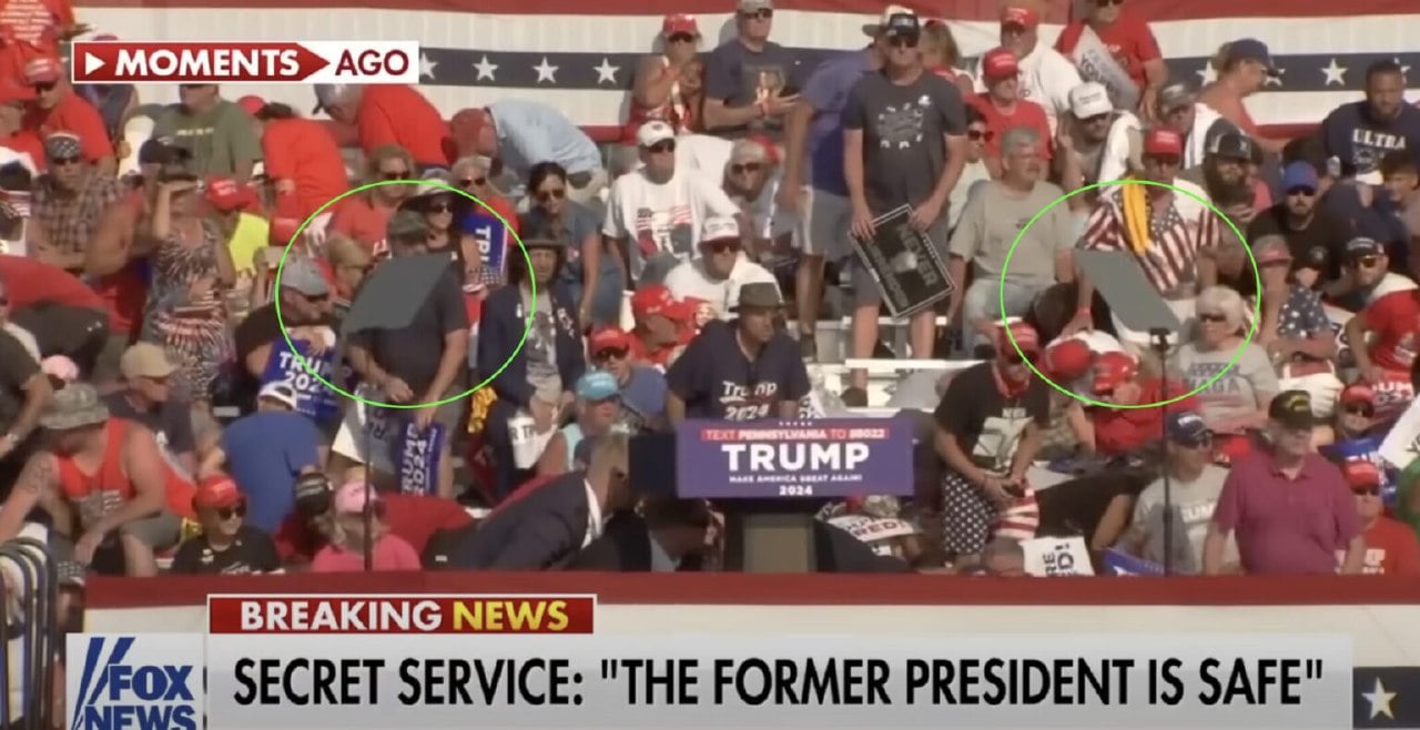 Frame showing both teleprompters intact after Trump was brought down to the ground after being shot